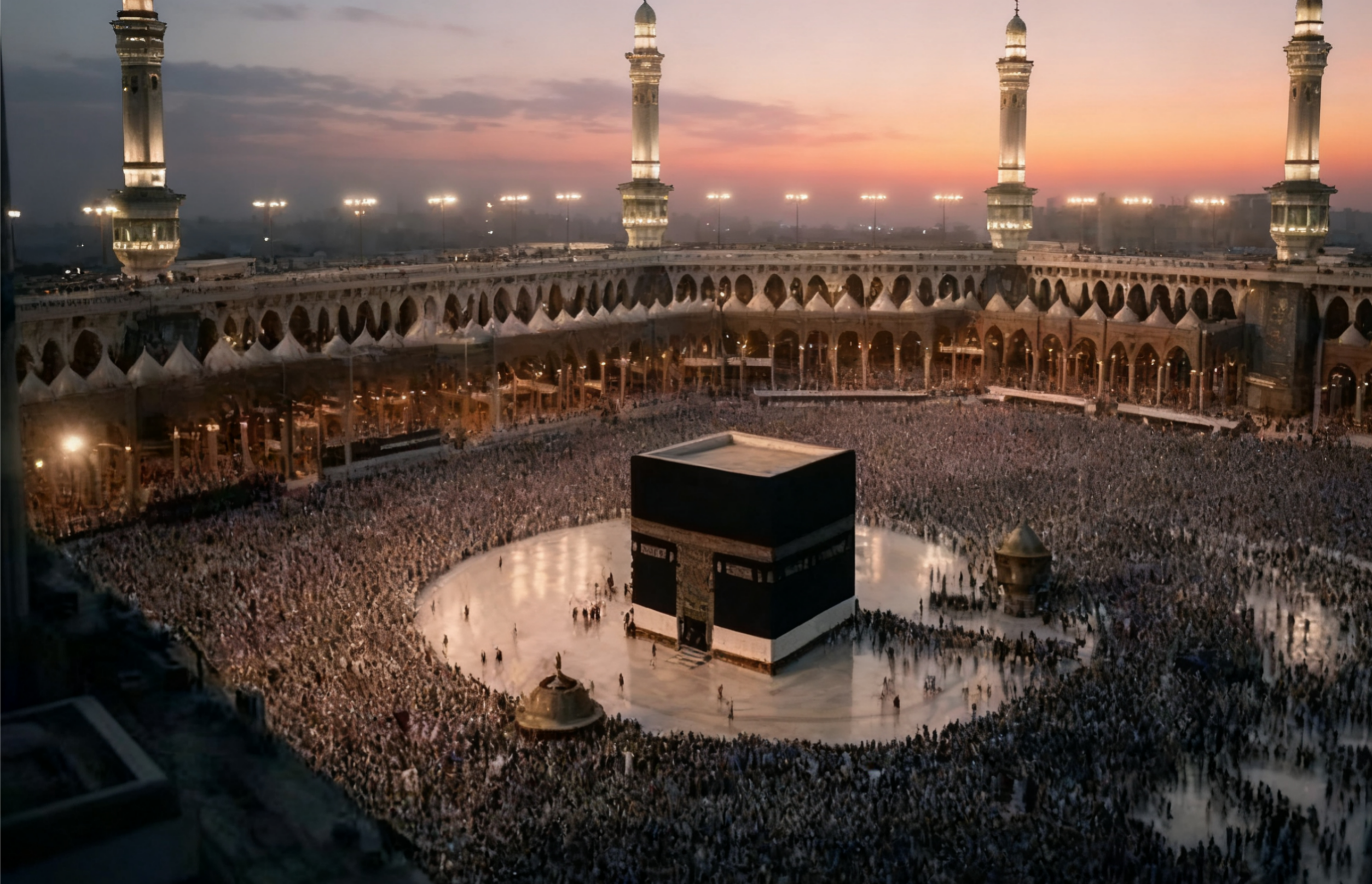 Kaaba at the centre of the Grand Mosque in Mecca, surrounded by thousands of pilgrims performing tawaf at sunset.